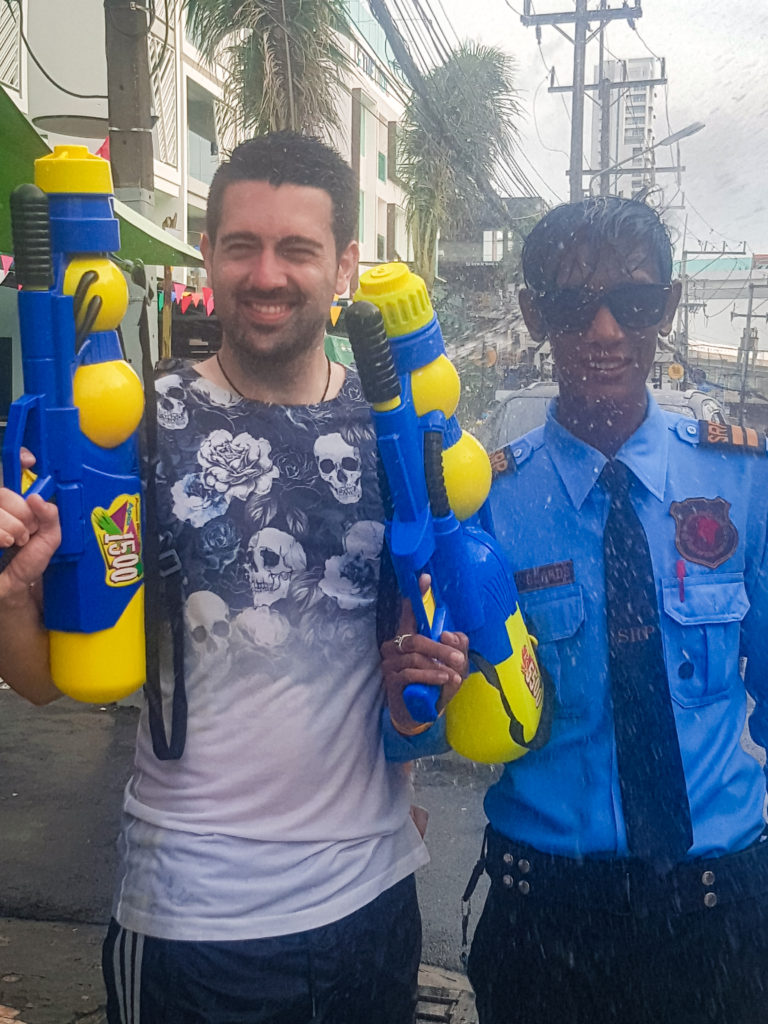 Thai police officer celebrating Songkran in Phuket Thailand