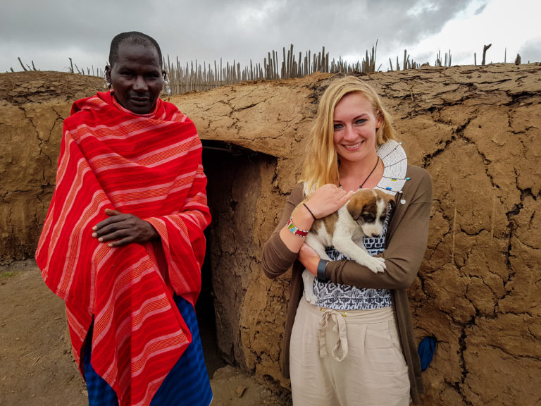 Tribe Chief and puppy in front of the Maasai hut - Ngorongoro - Tanzania