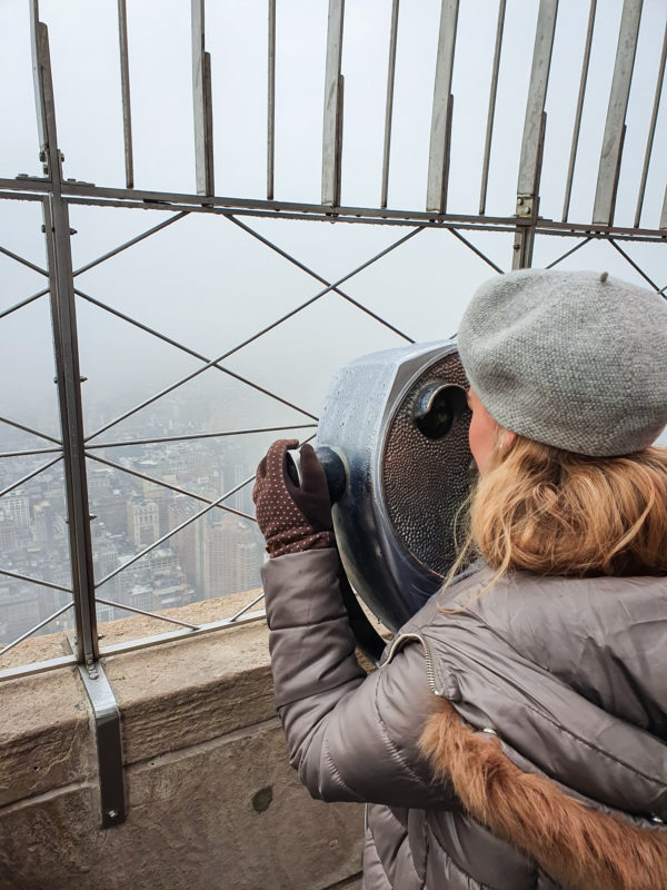 Views from the 86th floor observatory deck of the Empire State Building on a cloudy day