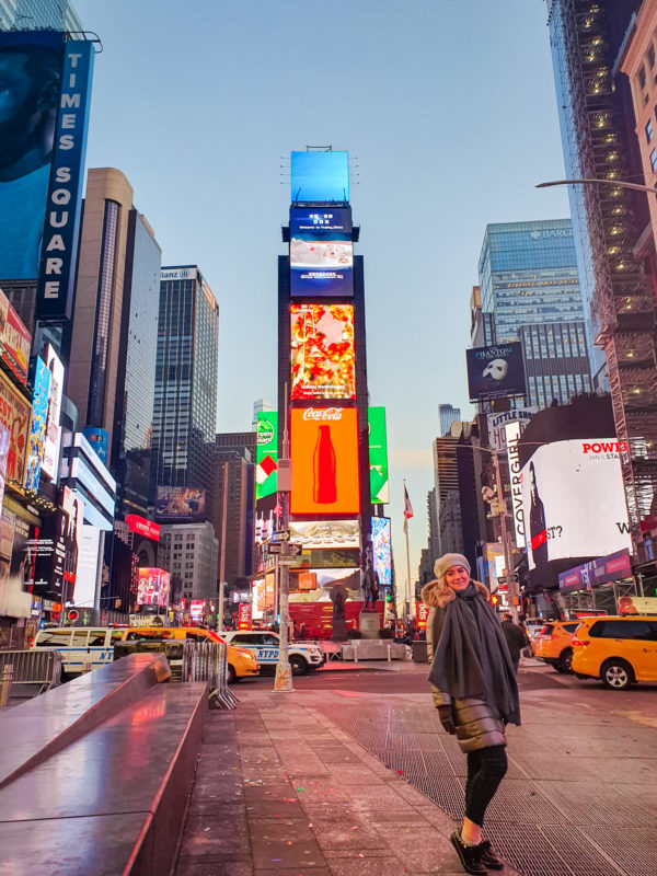 Times Square in New York City just before sunrise with the yellow cabs