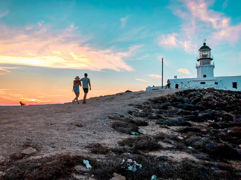 Watching the sunset at Armenistis Lighthouse in Mykonos, Greece