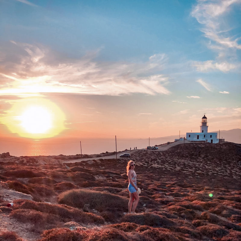 Watching the sunset at Armenistis Lighthouse in Mykonos, Greece