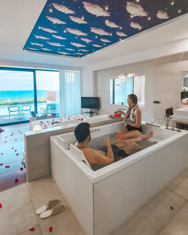 Couple in jacuzzi of Honeymoon Suite at Lesante Blu resort in Zakynthos, Greece
