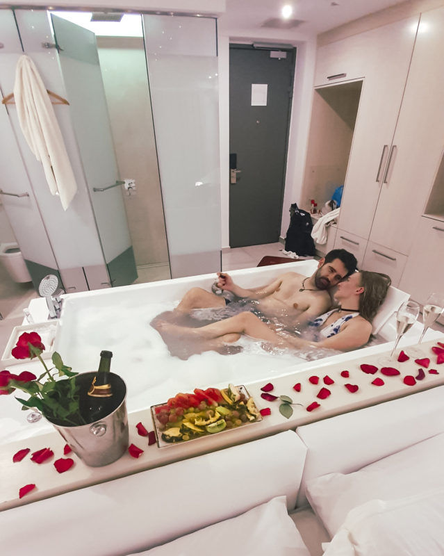Couple in jacuzzi of Honeymoon Suite at Lesante Blu resort in Zakynthos, Greece