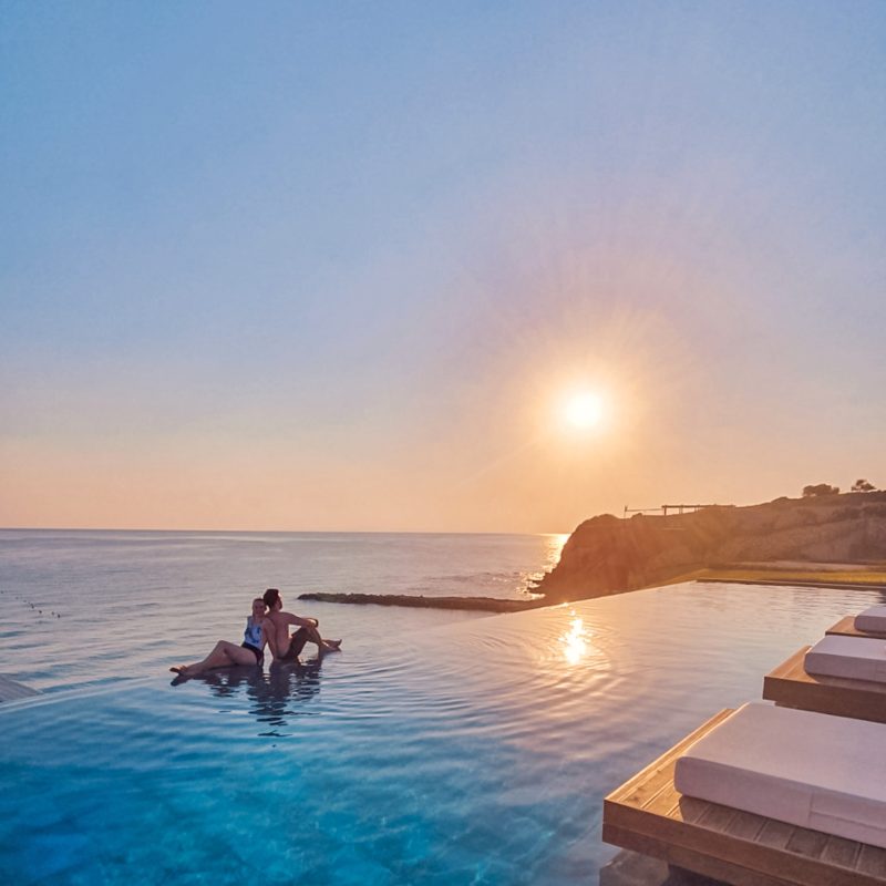 Romantic sunrise at the communal infinity pool at Lesante Blu resort in Zakynthos, Greece