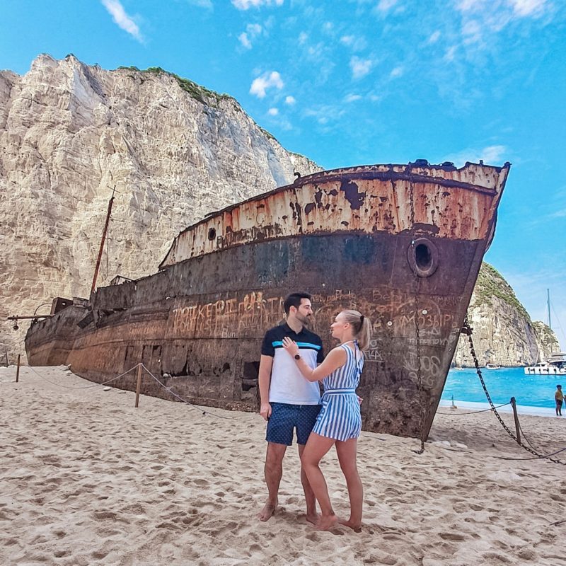 Couple posing at the Shipwreck Beach / Navagio Beach in Zakynthos (Greece)