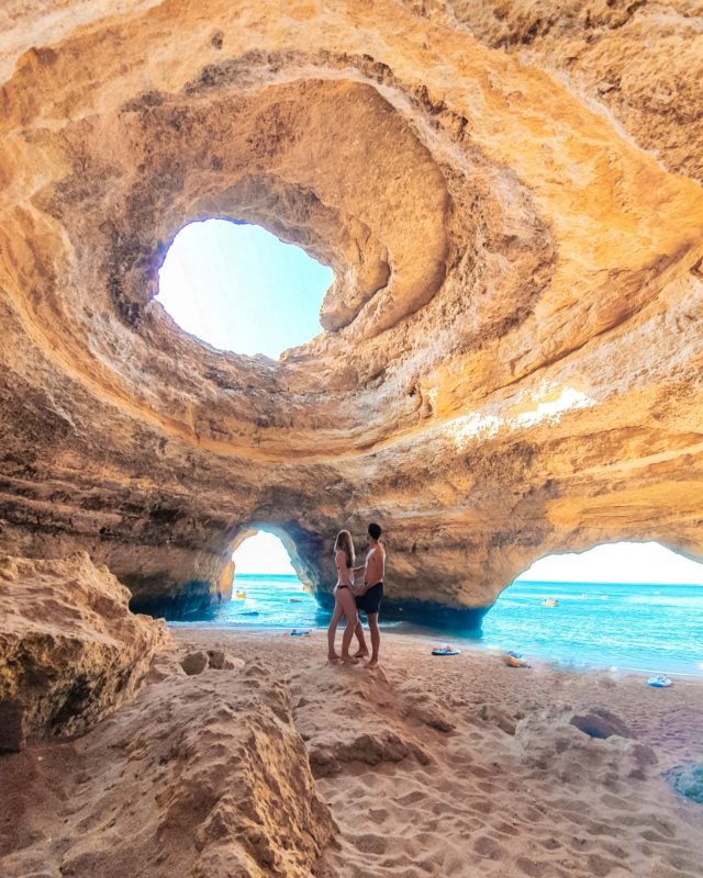 Couple posing at Benagil Caves in Algarve, Portugal