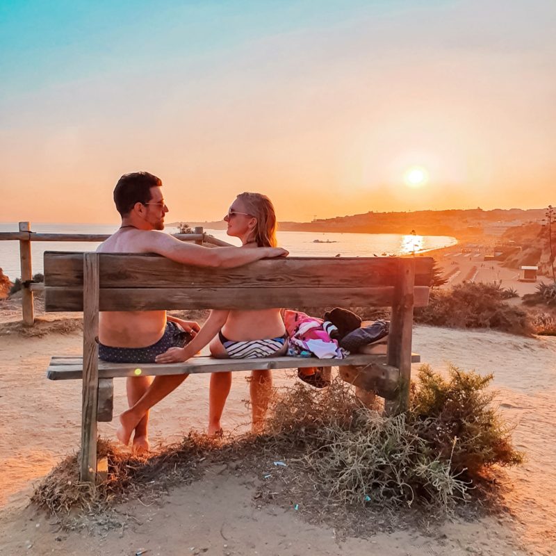 Couple posing at Praia dos Aveiros in Algarve, Portugal