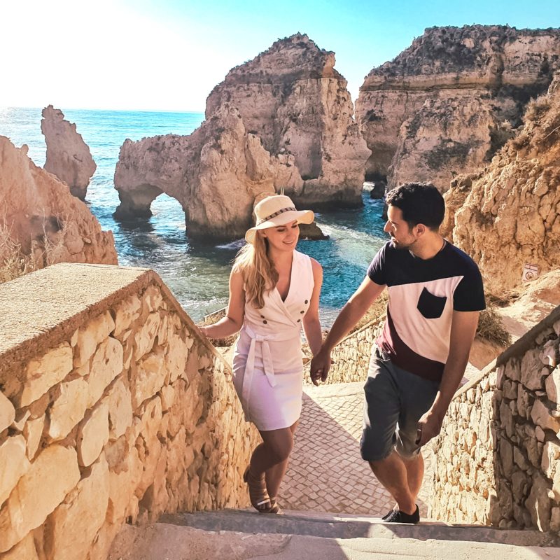 Couple posing at Ponta da Piedade in Algarve, Portugal