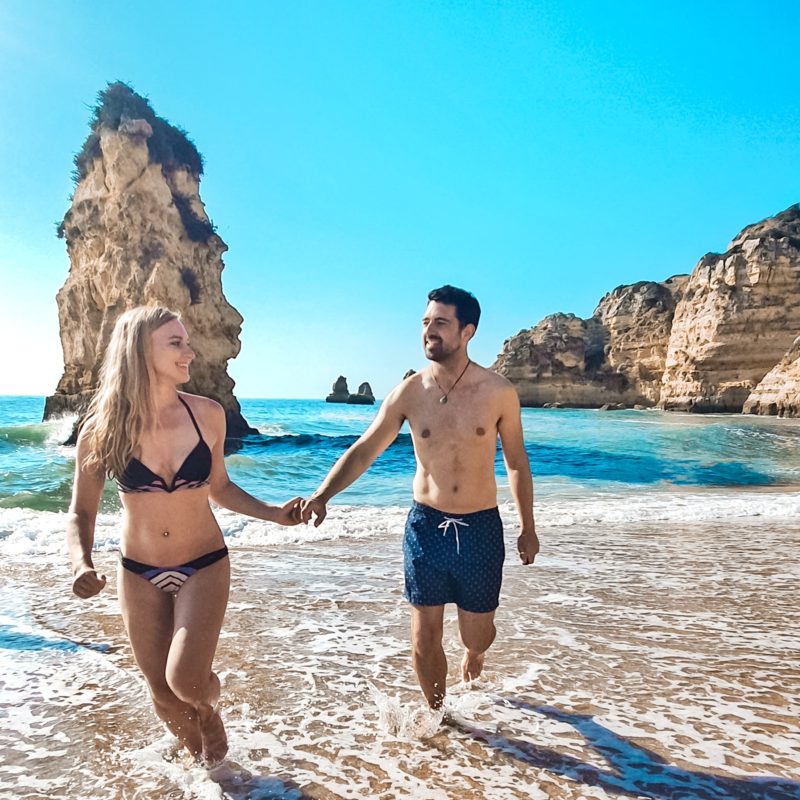 Couple posing at Praia Dona Ana in Algarve, Portugal