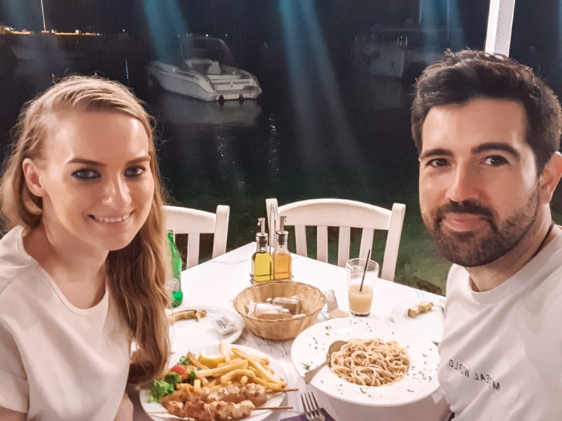 Couple having dinner with seaviews at Agios Nikolaos in Zakynthos, Greece