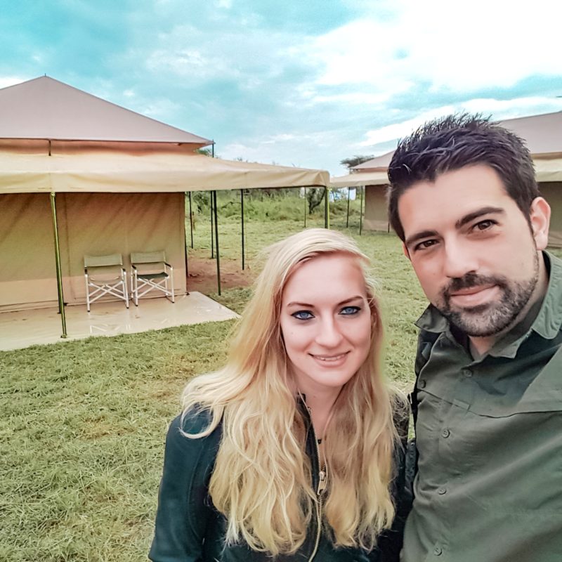 Travel Couple staying in a tent at Serengeti Wild Camps in Tanzania, Africa
