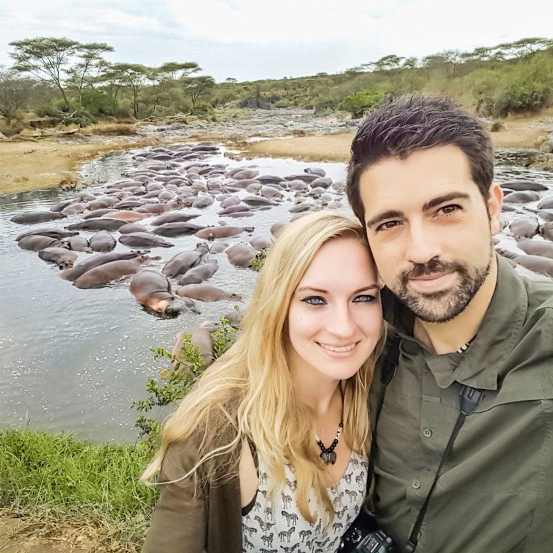 Travel Couple at the Hippo Pool in Serengeti, Tanzania