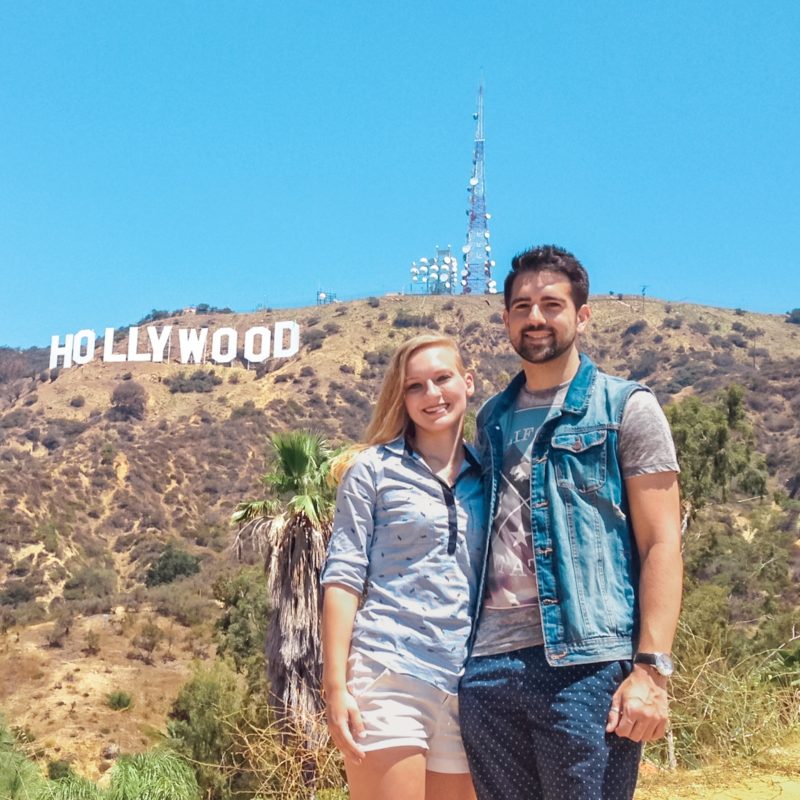 Couple in front of Hollywood sign, California USA