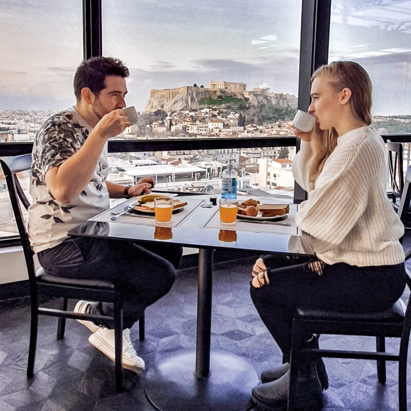 Couple having breakfast with Acropolis views at Astor Hotel Athens (Greece)