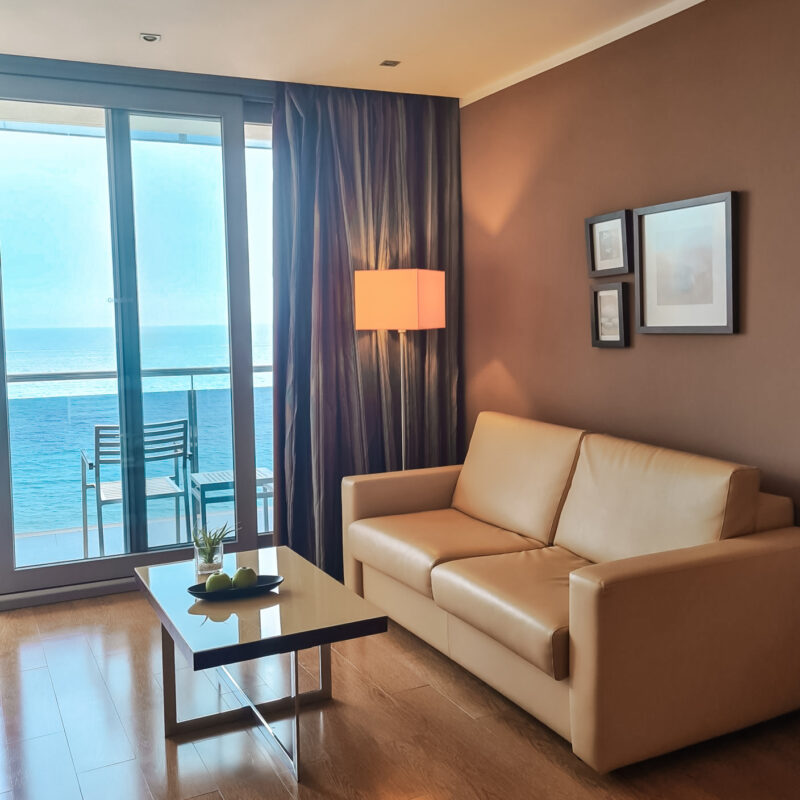 Sofa and balcony in Double Room, Sea View at hotel Sol Y Mar in Calpe, Costa Blanca, Spain