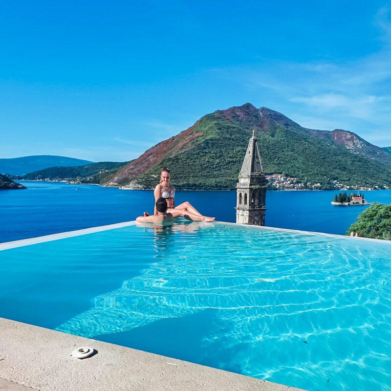 Couple enjoying views from infinity pool at Monte Bay Retreat in Montenegro