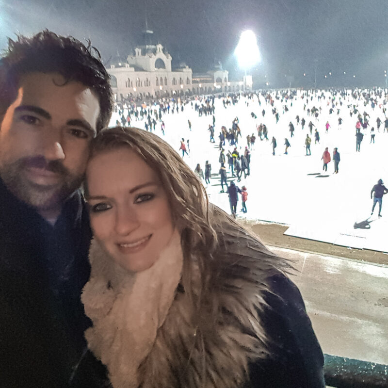 Couple posing at ice rink in Budapest, Hungary