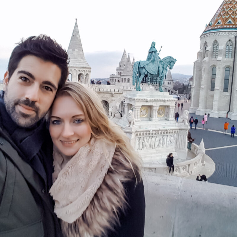 Selfie of a travel couple in front of Fisherman's Bastion in Budapest, Hungary
