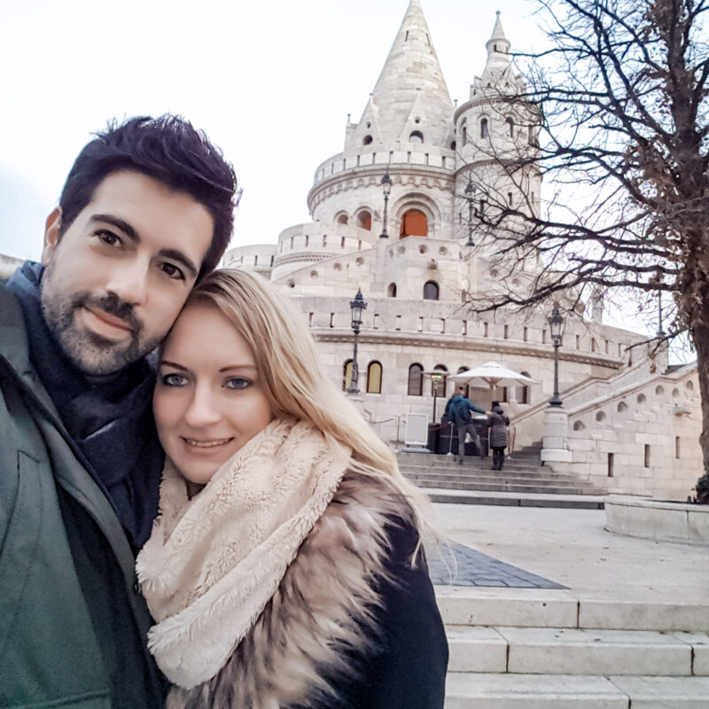 Selfie of a travel couple in front of Fisherman's Bastion in Budapest, Hungary