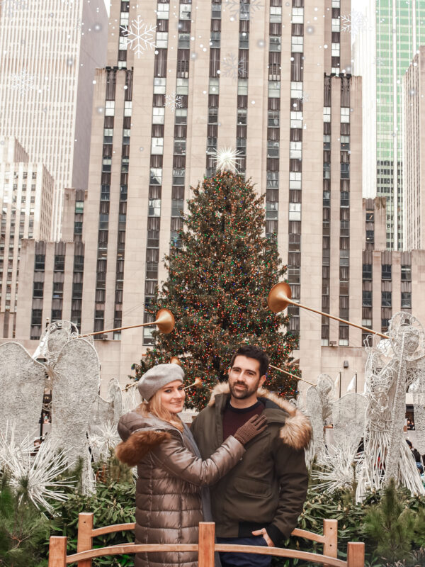 Travel Couple watching the Christmas Tree in New York City