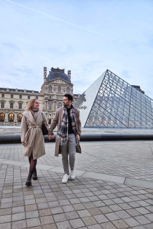 Romantic Photo Spots in Paris for Couples - Travel Couples Posing in front of the Louvre