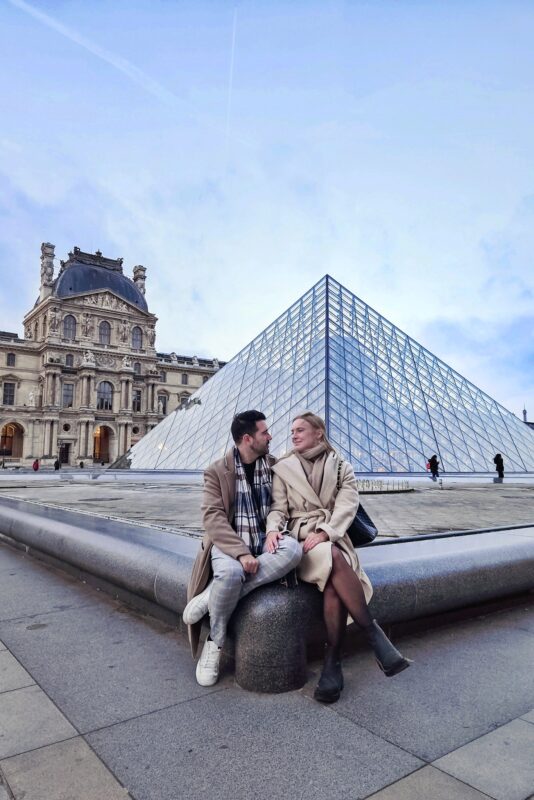 Romantic Photo Spots in Paris for Couples - Travel Couples Posing in front of the Louvre