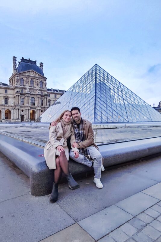 Romantic Photo Spots in Paris for Couples - Travel Couples Posing in front of the Louvre