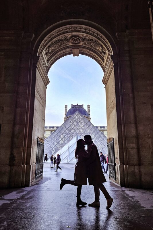 Romantic Photo Spots in Paris for Couples - Travel Couples Posing in front of the Louvre