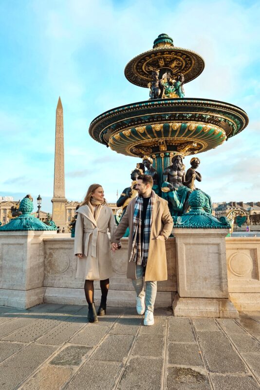 Romantic Photo Spots in Paris for Couples - Travel Couple posing in front of Fountain of Rivers, Place de la Concorde