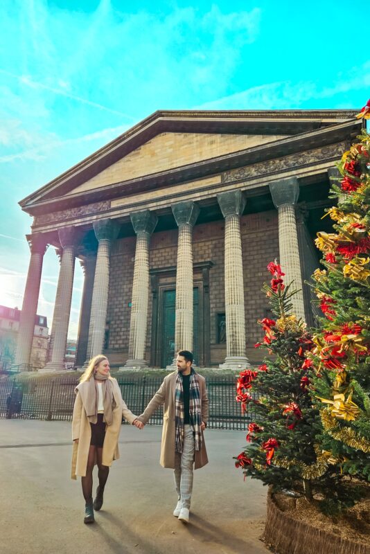 Romantic Photo Spots in Paris for Couples - Travel Couple posing in front of La Madeleine