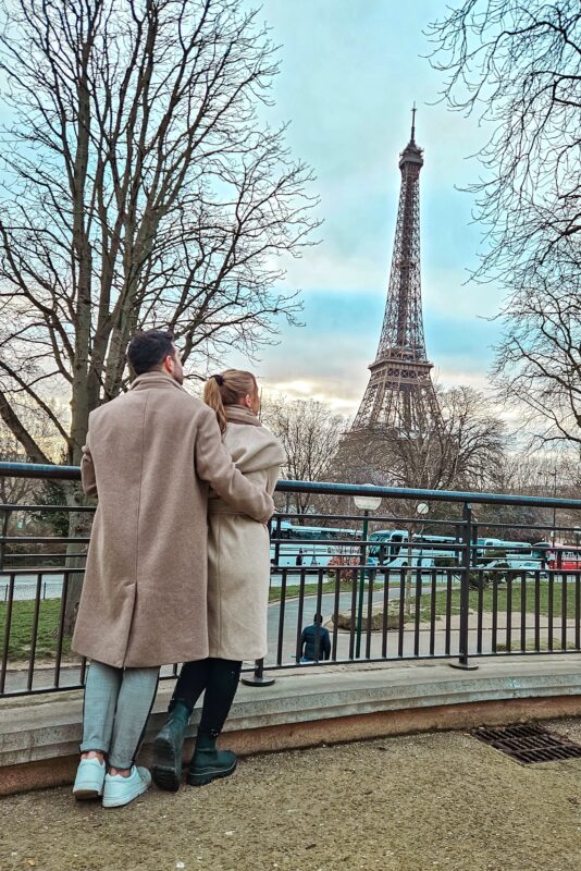 Romantic Photo Spots with Eiffel Tower in Paris - Travel Couple posing with Eiffel Tower at Avenue Albert de Mun