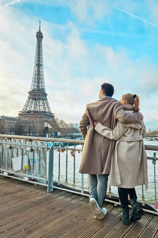 Romantic Photo Spots with Eiffel Tower in Paris - Travel Couple posing with Eiffel Tower at Passerelle Debilly Bridge