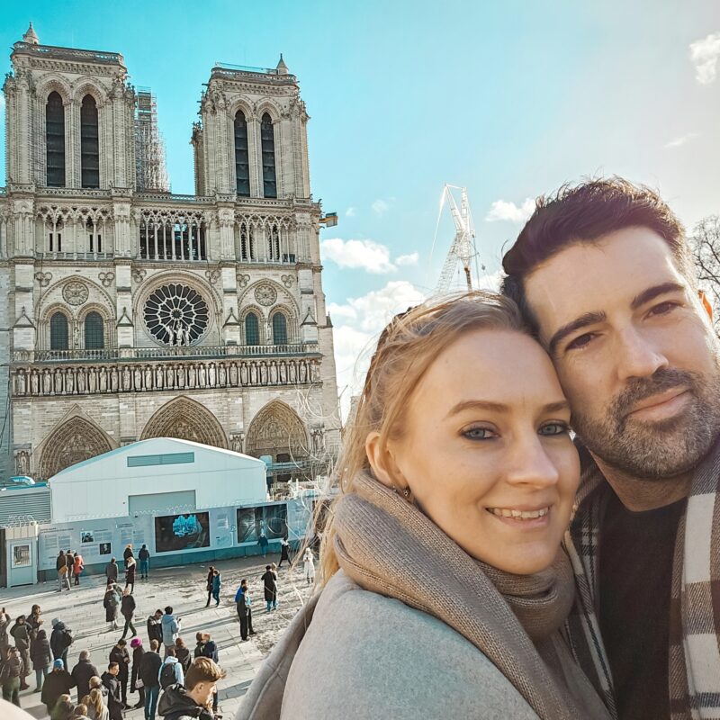 Romantic Photo Spots in Paris for Couples - Travel Couple taking a selfie with the Notre Dame