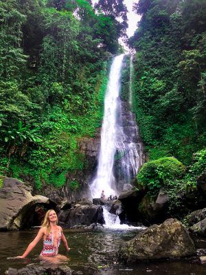 Bathing underneath the Gitgit waterfall in Bali