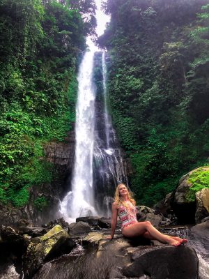 Bathing underneath the Gitgit waterfall in Bali