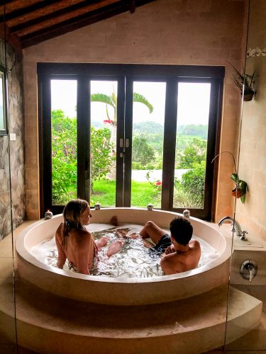 Romantic hot tub with views in the bathroom of Villa Sidemen Bali